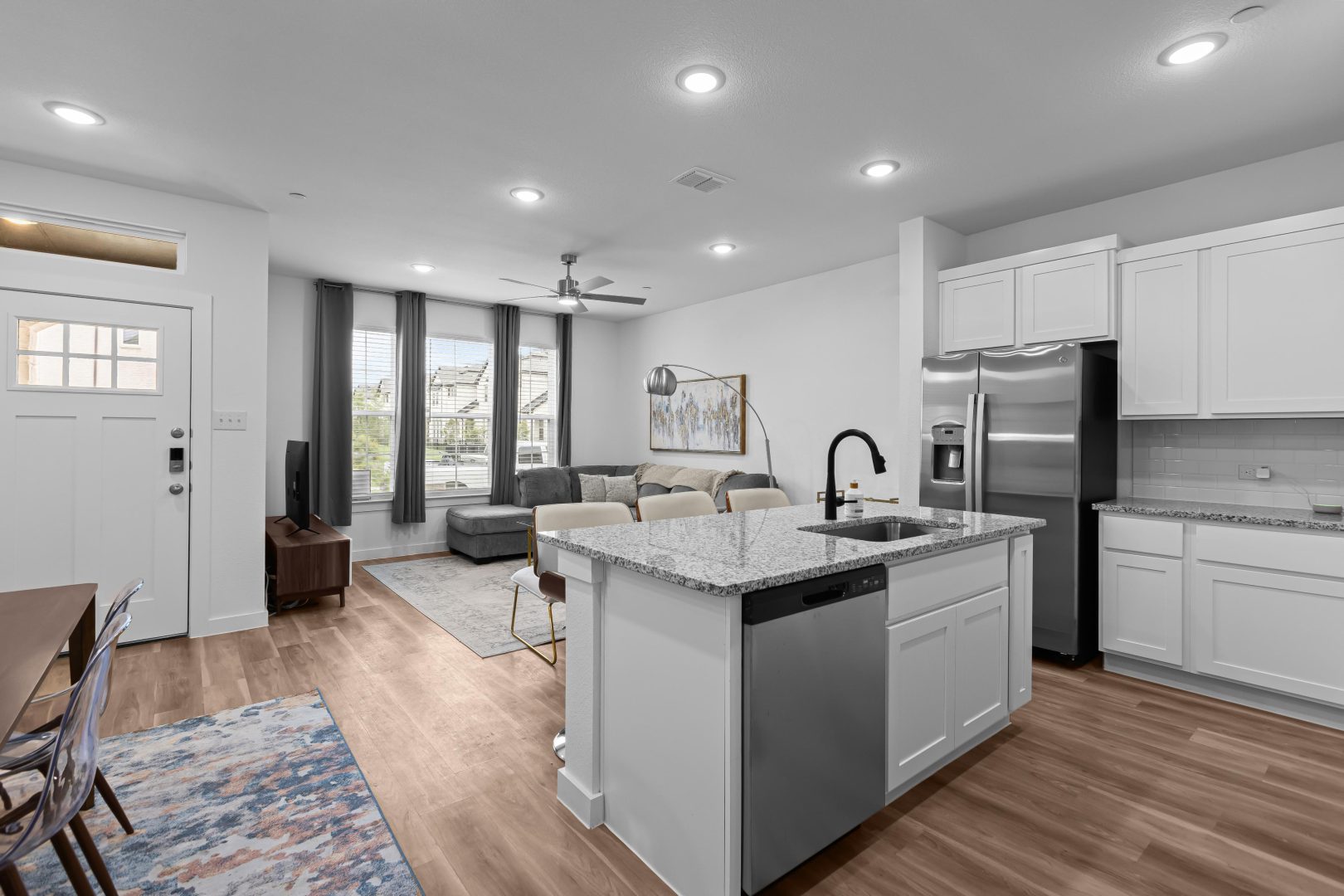 a black and white photo of a kitchen and living room at The Villas at Bardin