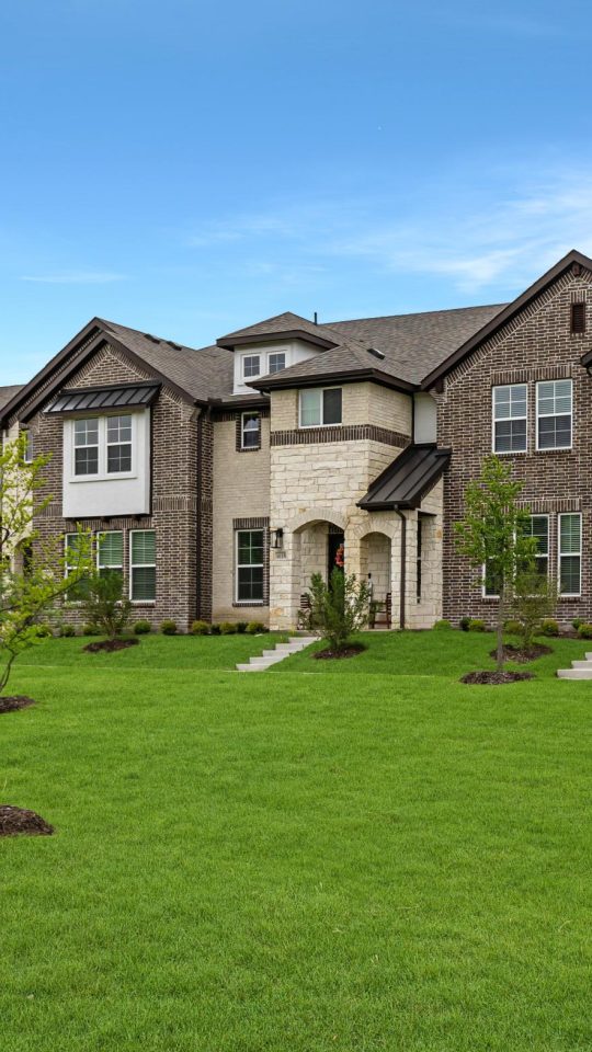 a large green lawn with many houses and trees at The Villas at Bardin