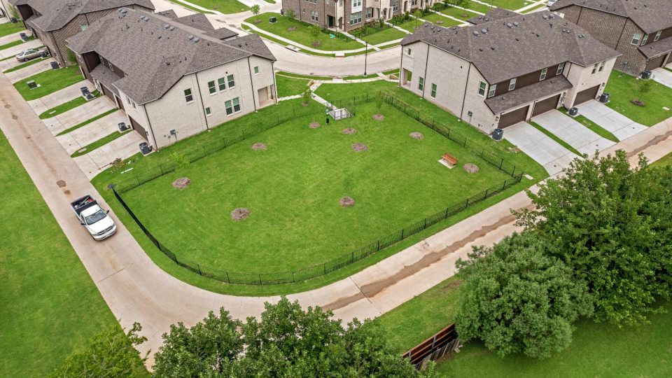 an aerial view of a residential neighborhood with a green lawn at The Villas at Bardin